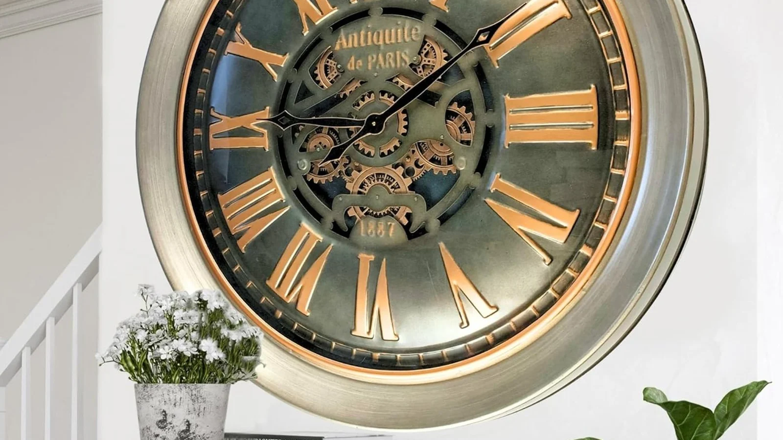 warm office wall clock and office workflow scene